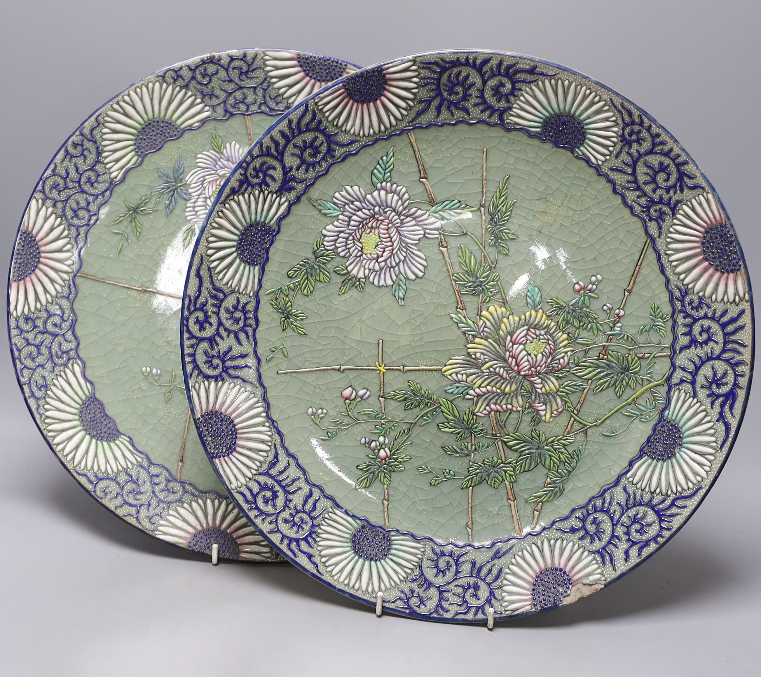A pair of Japanese pottery moriage celadon ground dishes, early 20th century, 38cm